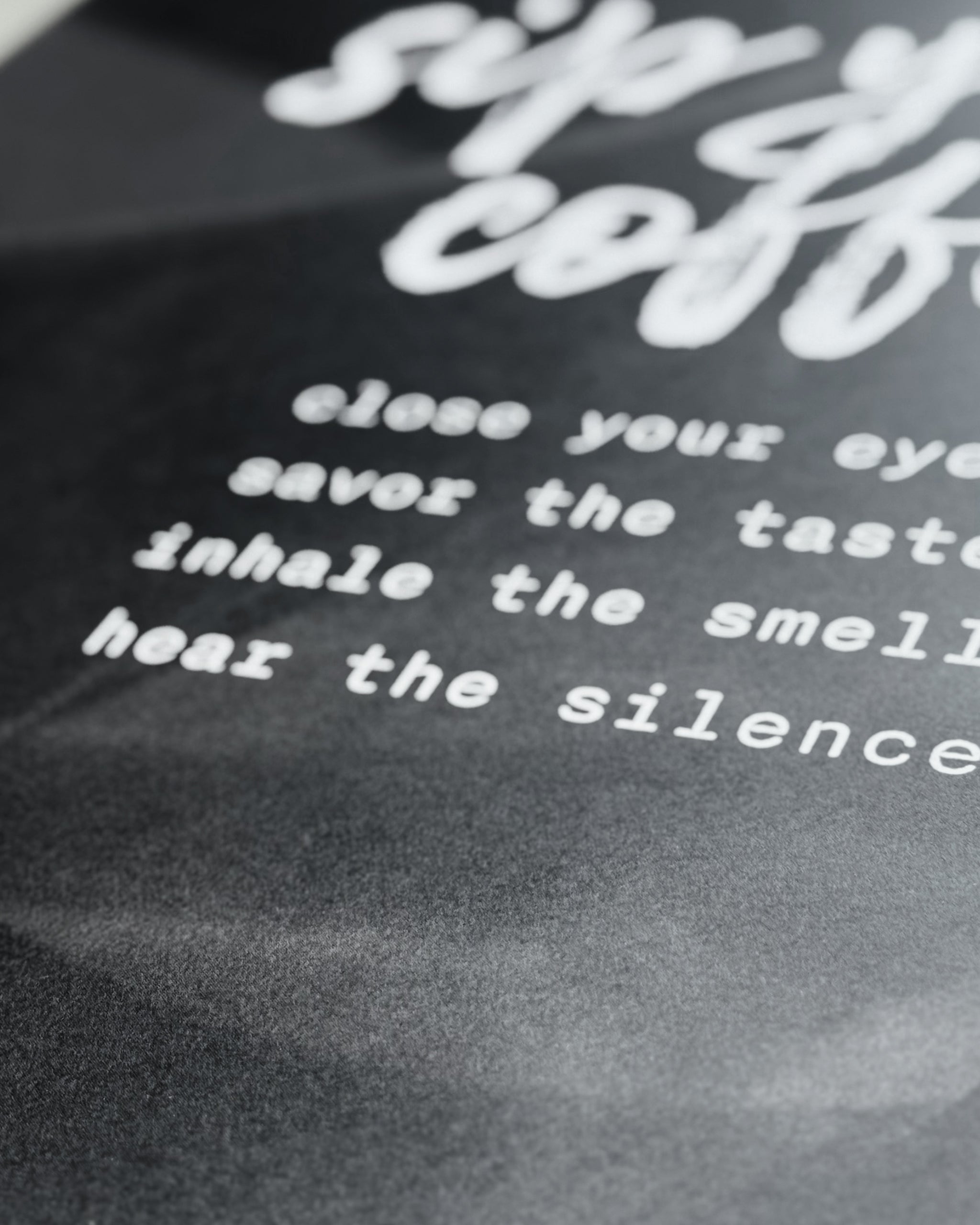 close up of 200 GSM matte paper coffee poster, showing the letters and the detail on the surface