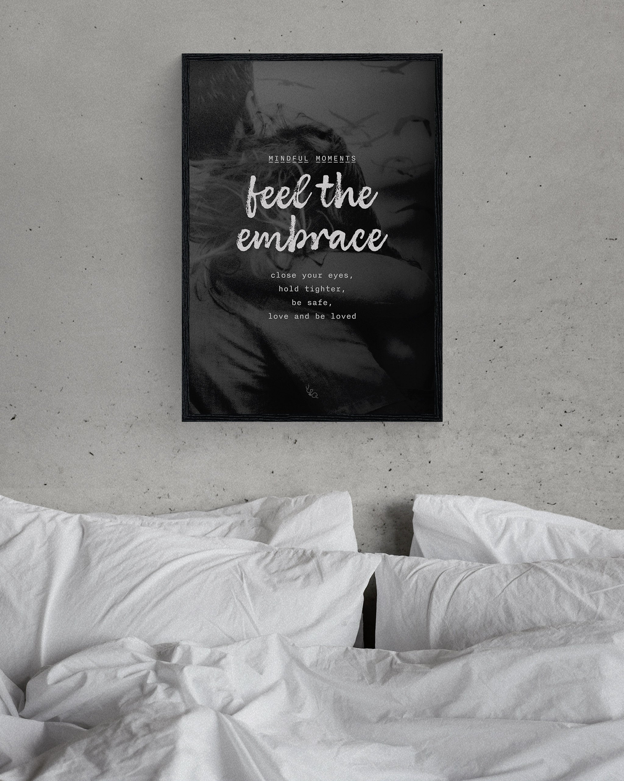 modern wall art on love in a simple black frame, on a minimalist grey bedroom wall above a bed with white sheets