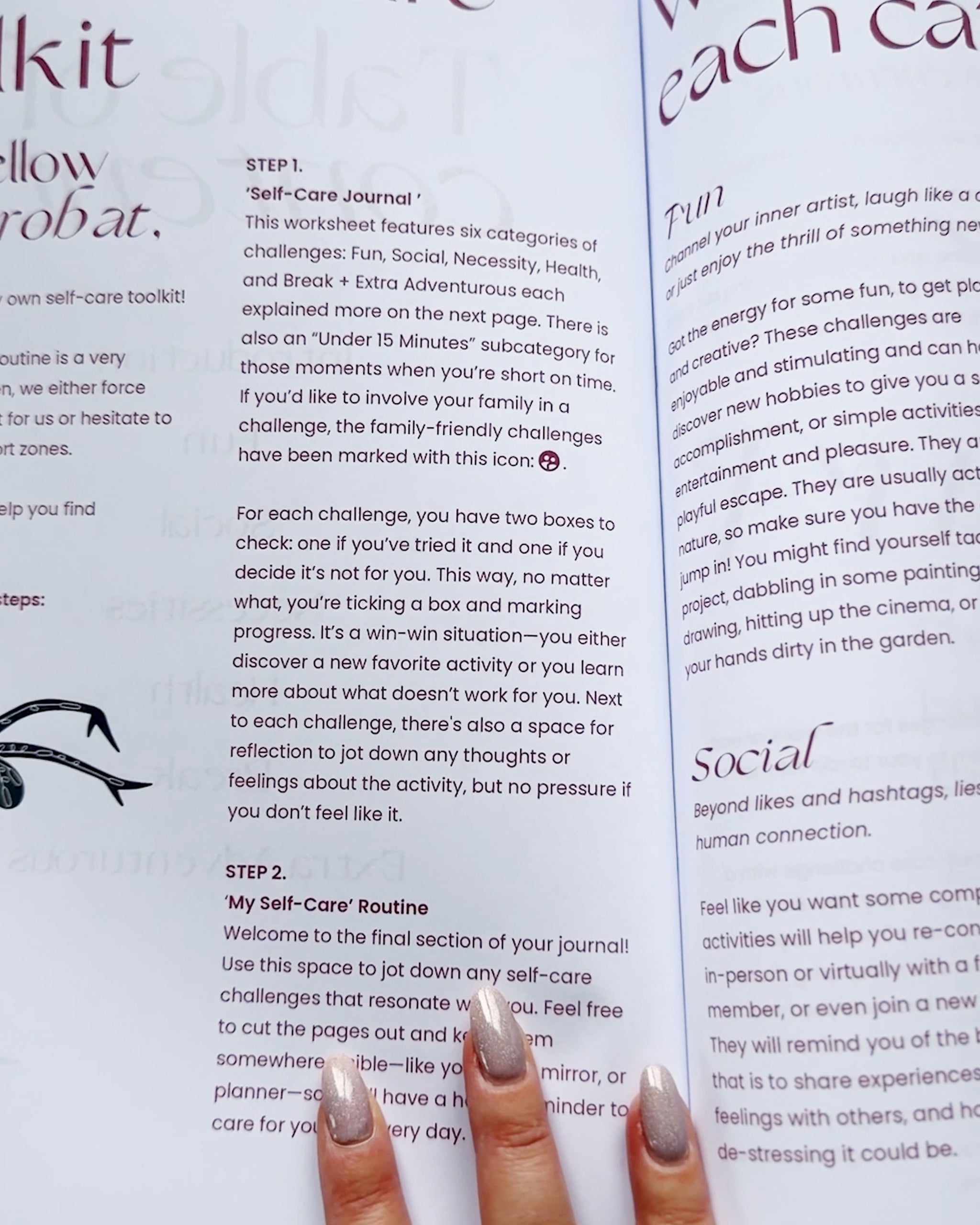 Hand holding a self-care journal open to pages explaining Step 1 and Step 2 of the journal.