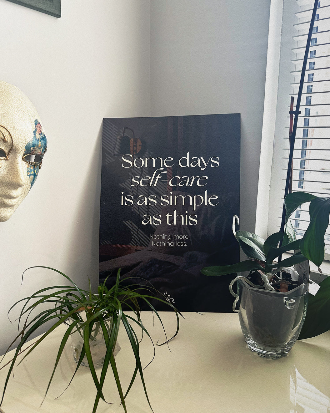 relax self care poster for room with text "some days self-care is as simple as this, nothing more, nothing less," displayed on a desk