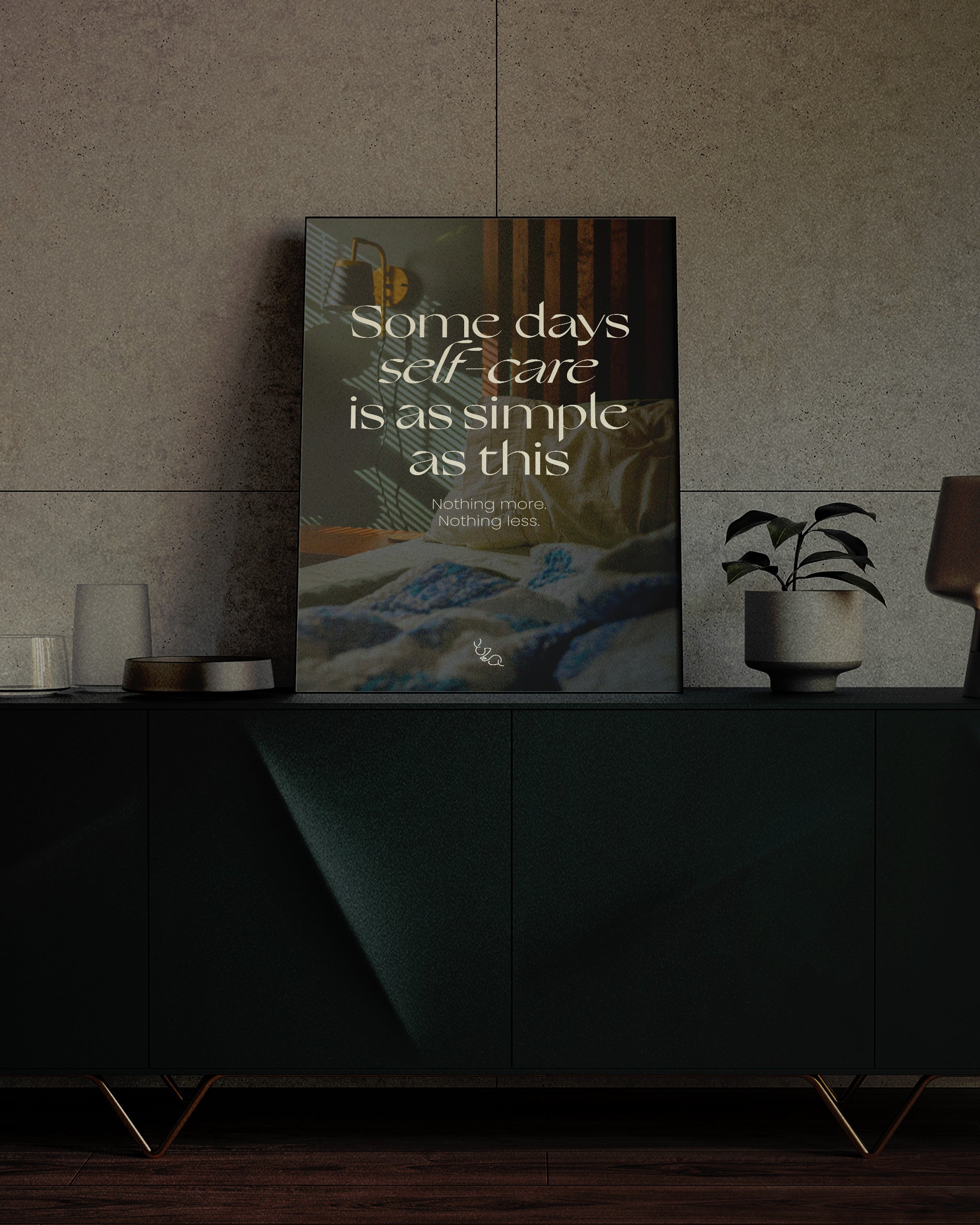 soothing self care wall art poster with text "some days self-care is as simple as this, nothing more, nothing less," displayed in a minimalist interior, sitting on a green desk, framed in a subtle black frame;
