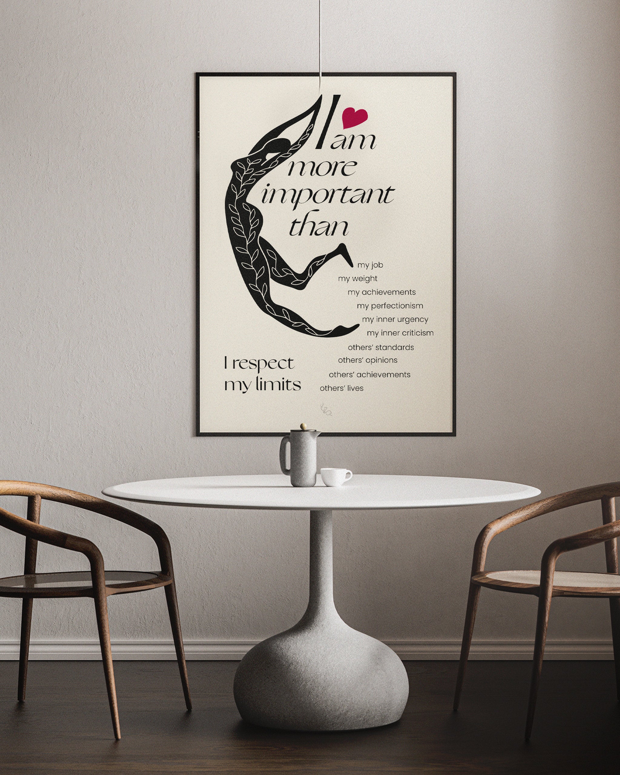 the perfectionist self care poster for room framed in a black frame and shown over of a table