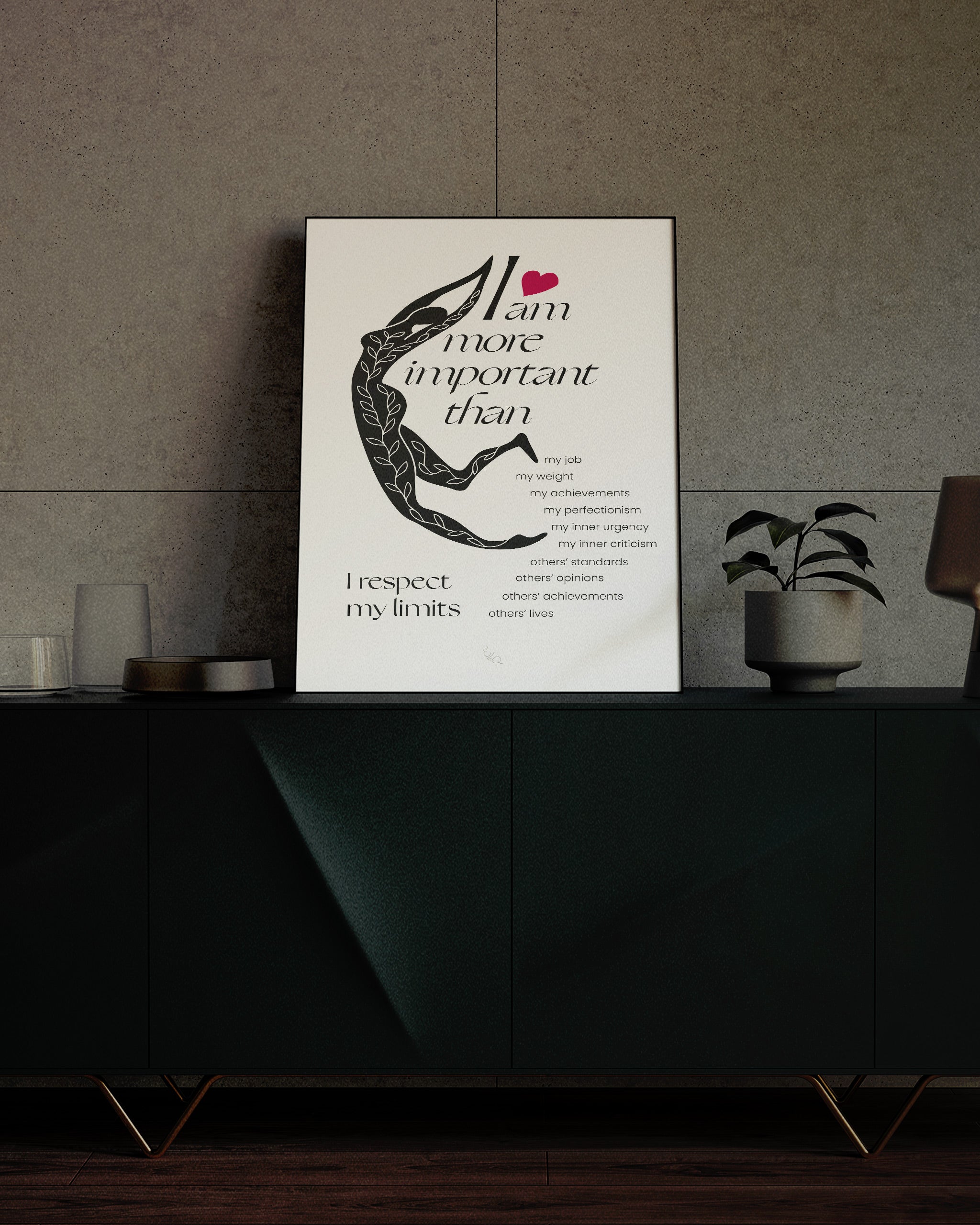 self love affirmations poster for perfectionism framed in a black frame and shown on a emerald desk