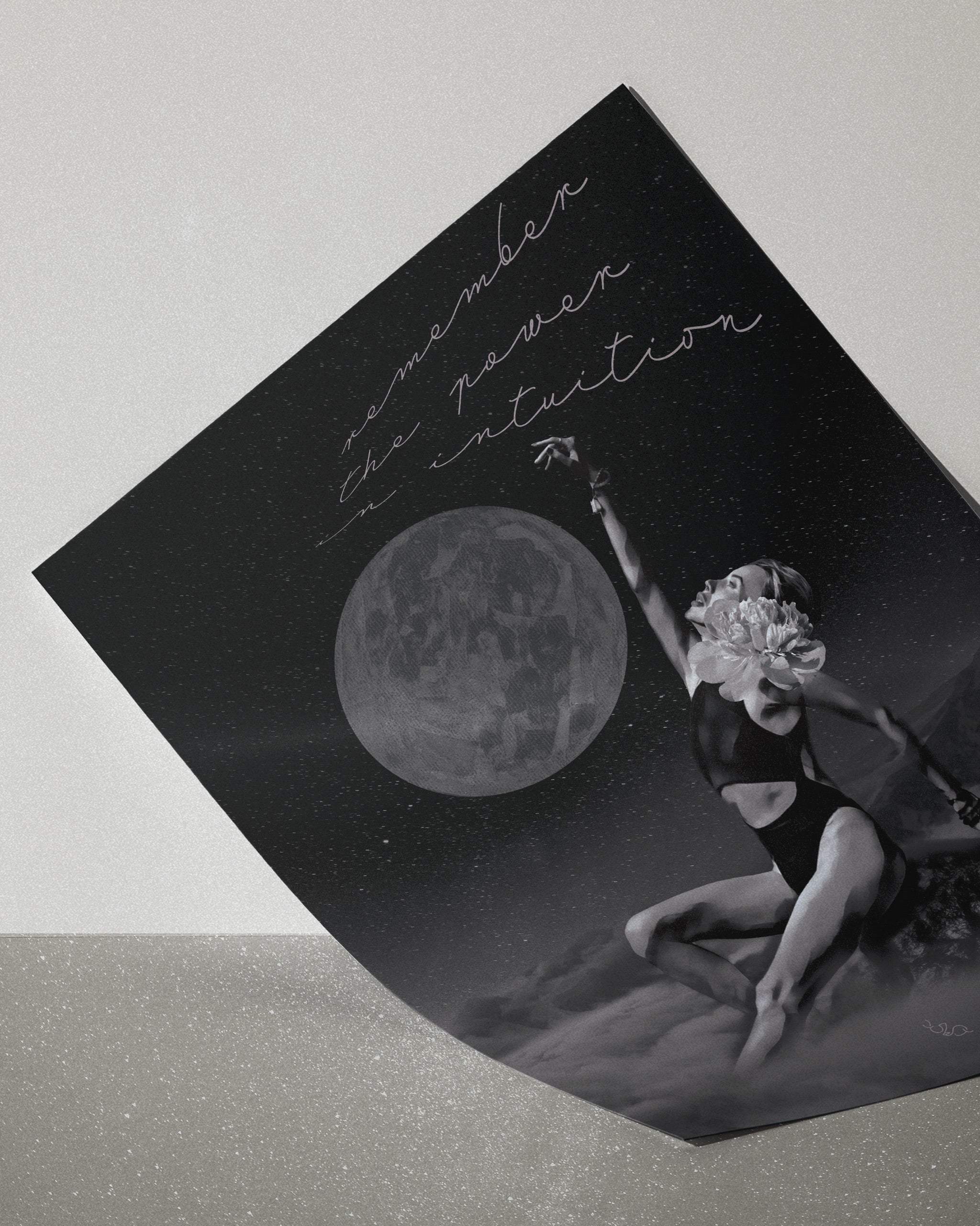black white and grey wall art of a shape shifter, with a woman reaching towards a moon, featuring text 'remember the power of intuition',