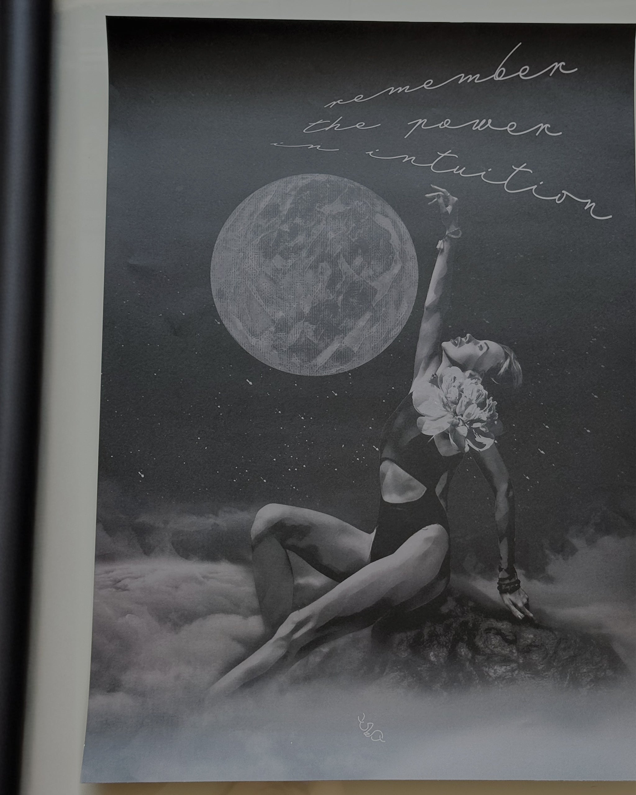 female energy dream artwork of a woman reaching towards a moon with text 'remember the power of intuition' on a dark background.