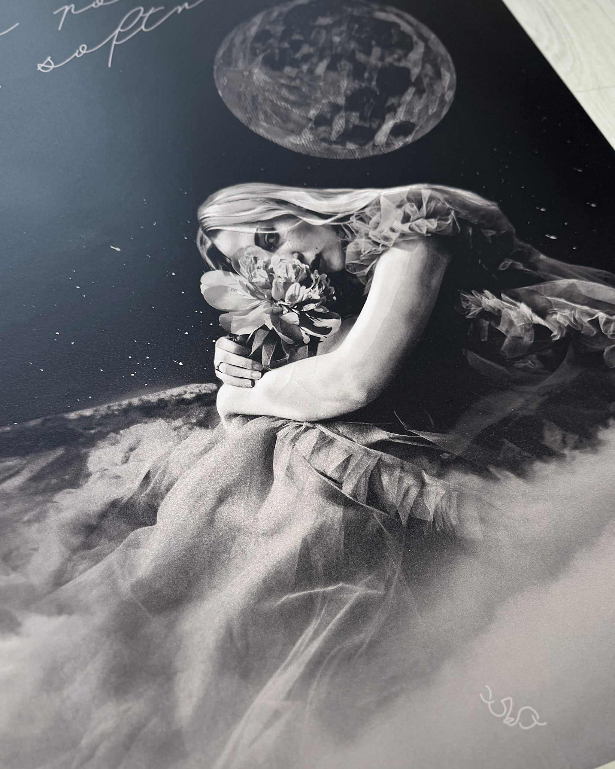 Black and white women empowerment posters of a woman, "the world changer", holding flowers with celestial elements.