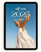 the digital photo self care 2025 calendar shown on an ipad device