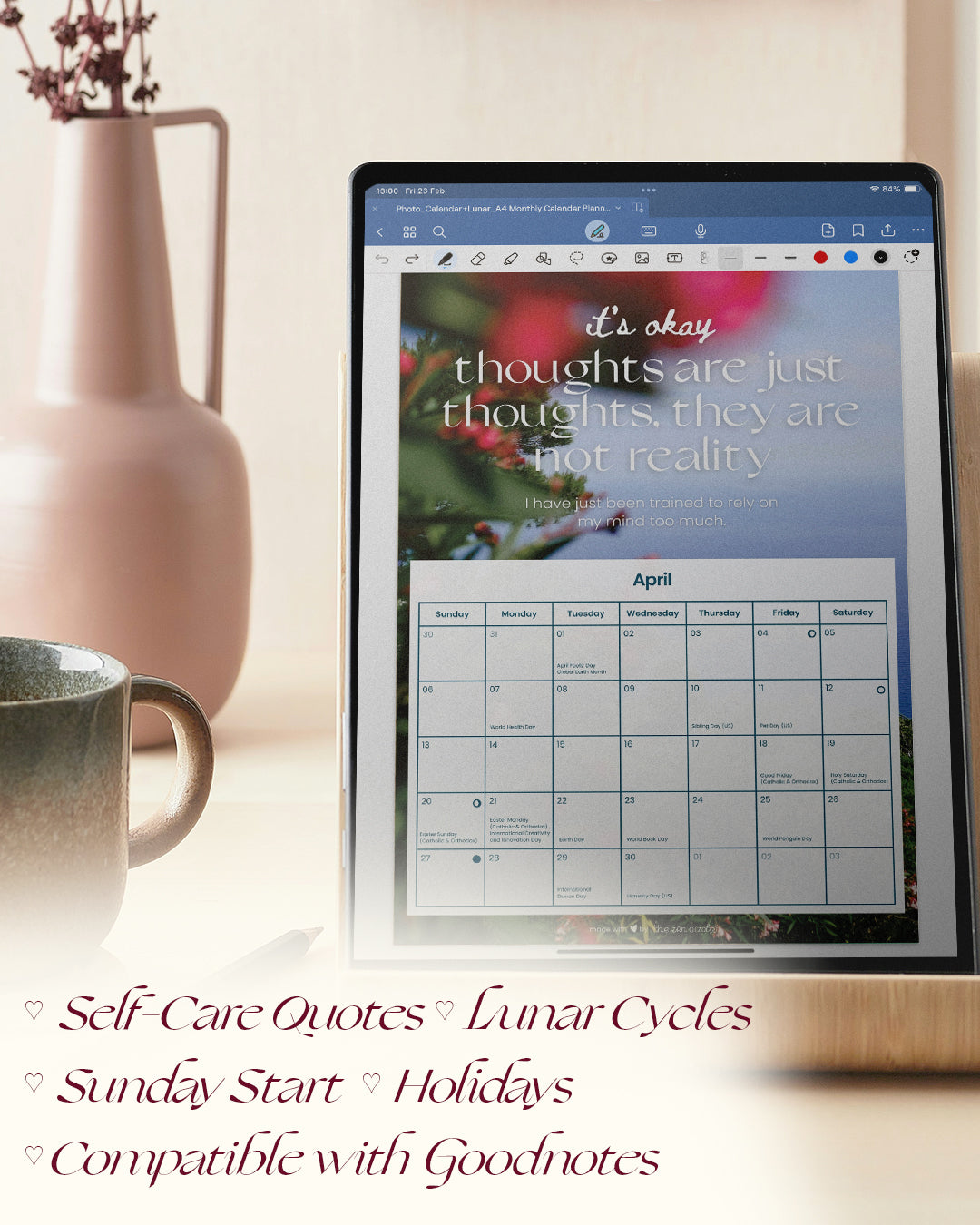 the ipad digital planner with self love affirmations shown on a tablet in the goodnotes interface, the example is the month of april; features self care quotes, lunar cycles, sunday start, holidays