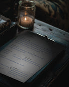 printable dream recorder shown filled in on a dark clip folder and a dark desk next to a candle and a sofa 