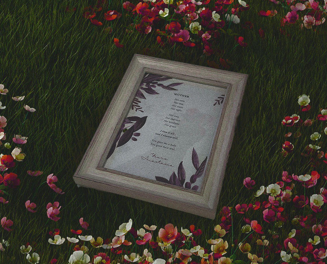 the zen acrobat poetry collection represented by the Beautiful Mothers Day & Birthday Card laying on a meadow of flowers